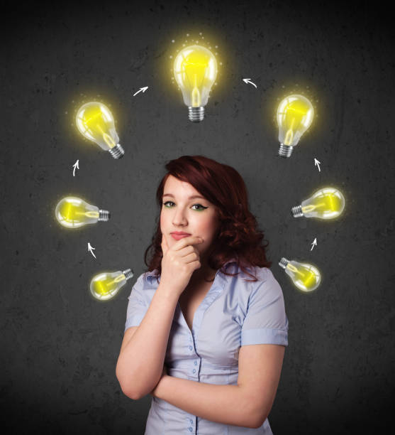 istock Young woman thinking with lightbulb circulation around her head 1131151799