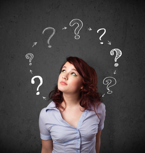 istock Young woman thinking with question mark circulation around her head 1131151840
