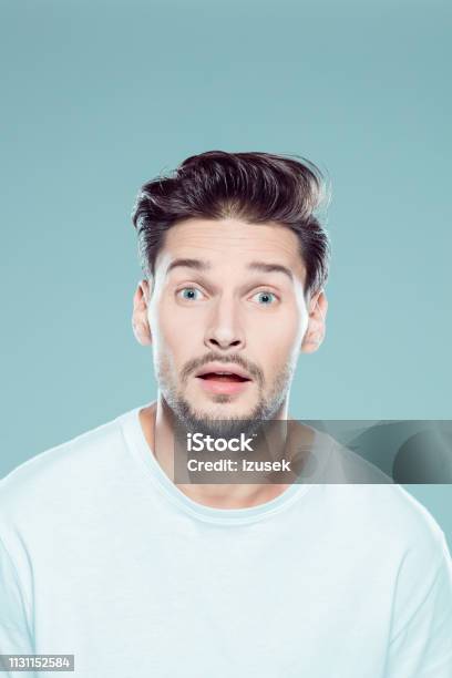 Young Man Looking Shocked Stock Photo - Download Image Now - Embarrassment, Human Face, 20-29 Years