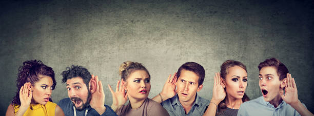 istock Funny looking gossip people communicating 1131153174