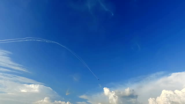 Single aerobatic plane on blue sky