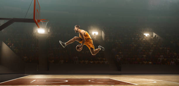 istock Basketball player in action. Making a basket 1131154559