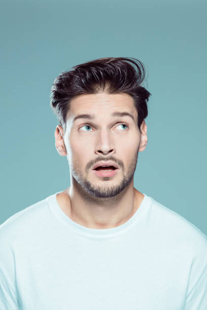 istock Close up of surprised young man 1131155509