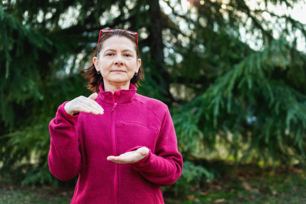 istock Woman using American sign language - hand gesture again 1131155880