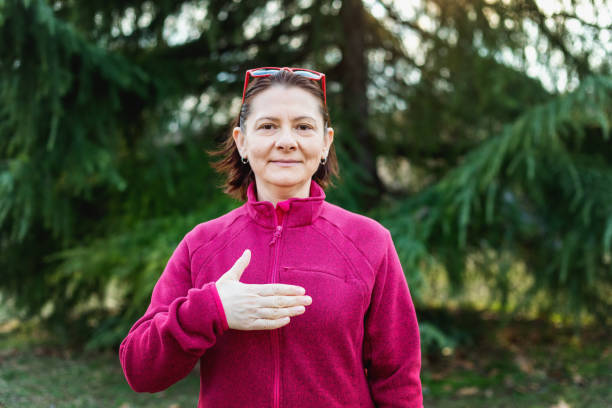 istock Woman using American sign language - hand gesture for please 1131155903