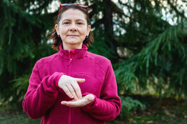 istock Woman using American sign language - hand gesture again 1131155910