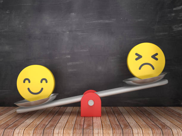 istock Seesaw Scale with Emoticons on Chalkboard Background - 3D Rendering 1131157028