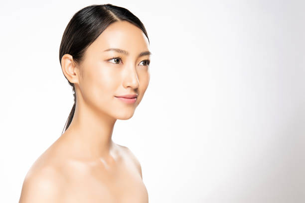 beautiful young asian woman with clean fresh skin - making human hair human face cosmetics imagens e fotografias de stock