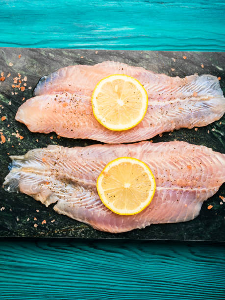 istock Red perch fillet on green marble board 1131157992
