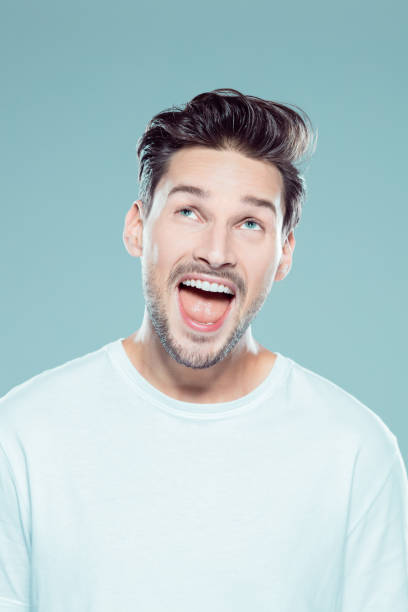 istock Portrait of excited young man 1131159025