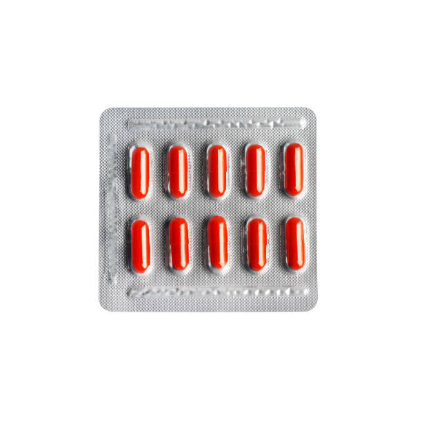 istock Red pill capsules in blister pack isolated on white background with clipping path 1131159274