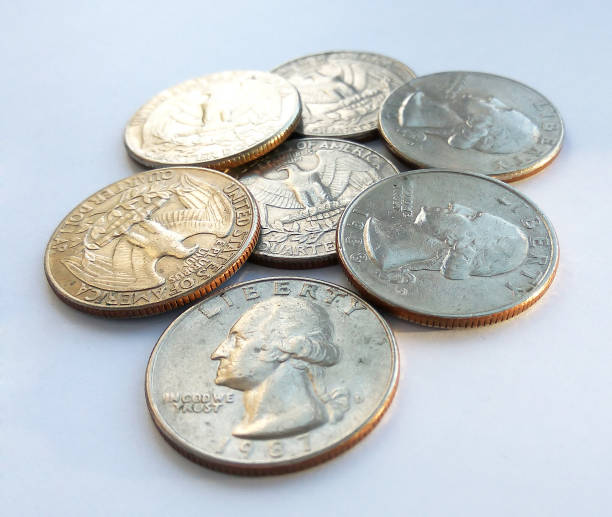 istock American quarters usa (25 cents) on white background 1131160358