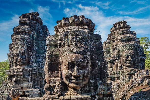 faces of bayon temple, angkor, camboya - angkor wat buddhism cambodia tourism fotografías e imágenes de stock