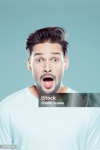 Close Up Of A Surprised Young Man Stock Photo - Download Image Now - Men, Rolling Eyes, Mouth Open