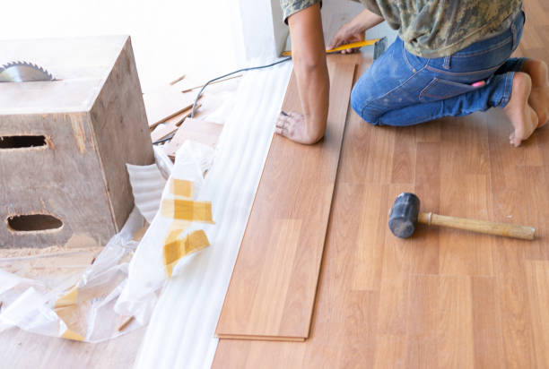 istock Man installing new laminated wooden floor 1131164287