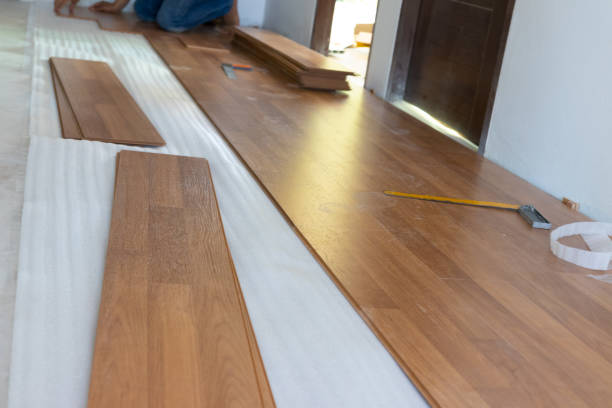 istock Man installing new laminated wooden floor 1131164853