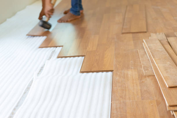 istock Man installing new laminated wooden floor 1131164952