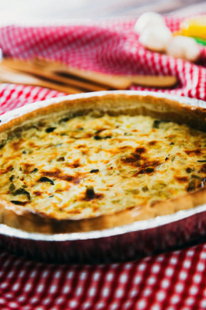 istock VEGETABLE PIE WITH CHERRY TOMATOES, GRILLED PEPPERS AND COURGETTES With fresh eggs and fresh cream 1131166906