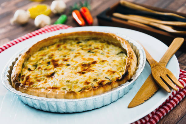 istock VEGETABLE PIE WITH CHERRY TOMATOES, GRILLED PEPPERS AND COURGETTES With fresh eggs and fresh cream 1131167413