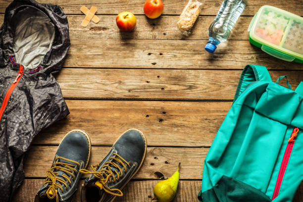 istock Traveling - packing (preparing) for adventure trip concept 1131169863