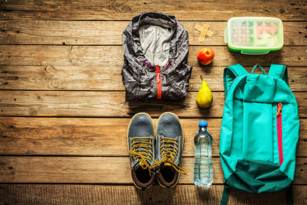 istock Traveling - packing (preparing) for adventure trip concept 1131169865
