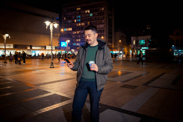 istock Man walking on the street at night 1131170586