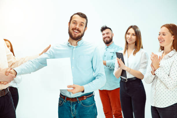 istock Boss approving and congratulating young successful employee 1131170588