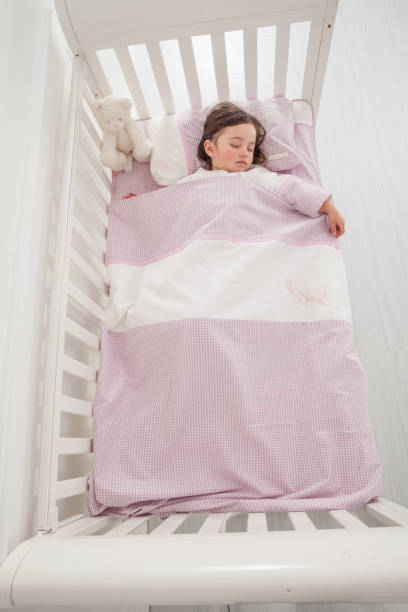 istock Little cute girl sleeping in bed 1131171571