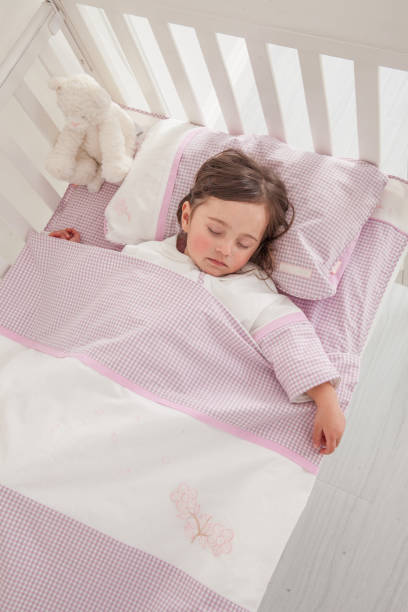 istock Little cute girl sleeping in bed 1131171582