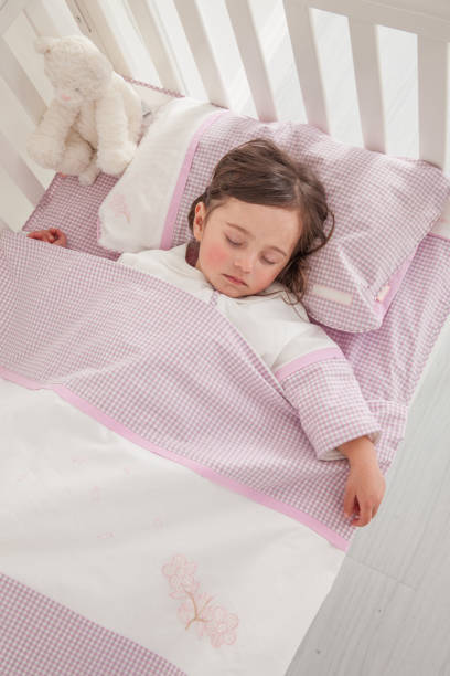 istock Little cute girl sleeping in bed 1131171629