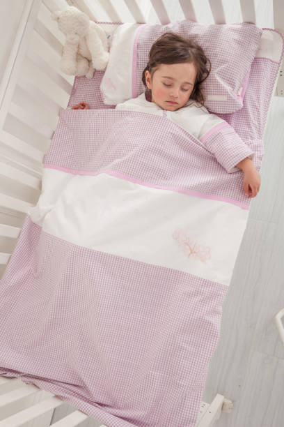istock Little cute girl sleeping in bed 1131171651