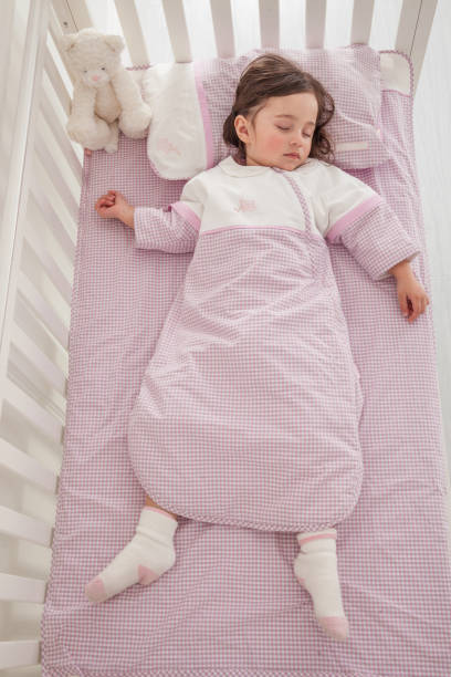 istock Little cute girl sleeping in bed 1131171705