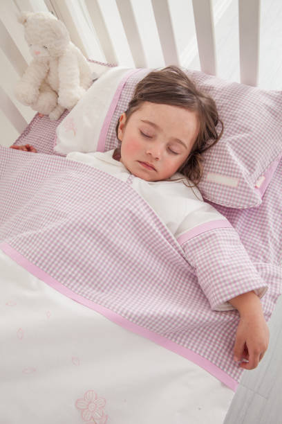 istock Little cute girl sleeping in bed 1131171740