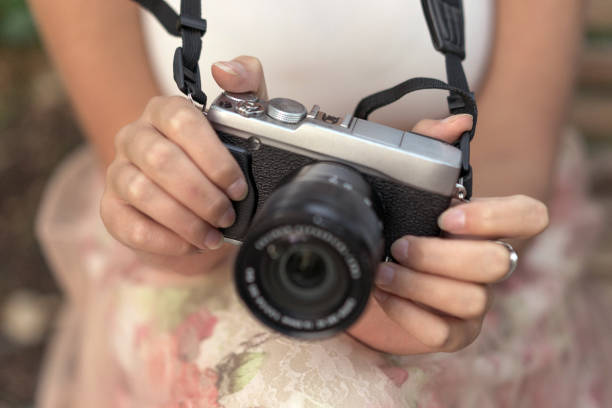 istock Hands of a girl with a camera 1131171888