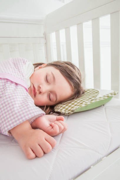 istock Little cute girl sleeping in bed 1131171993
