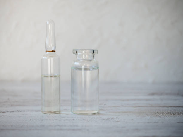 istock Glass ampoules with medication in the table 1131172960