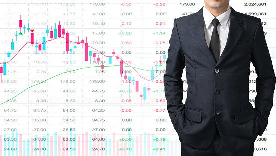 Portrait of businessman on stock graph blending with the stock table. Businessman investment by trading stock.