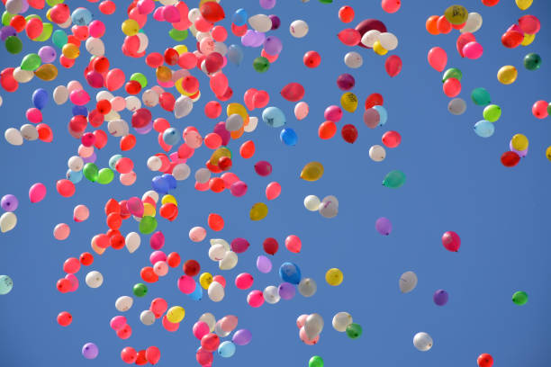 istock Colorful balloons in the blue spring sky. 1131174586