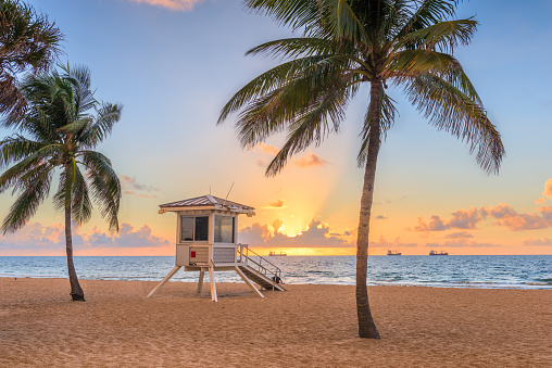 Fort Lauderdale, Florida, USA beach and life guard tower at sunrise.