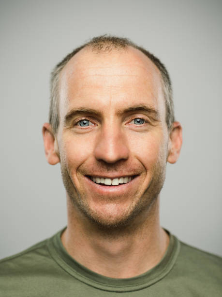 istock Portrait of real caucasian man with happy expression looking at camera 1131176964