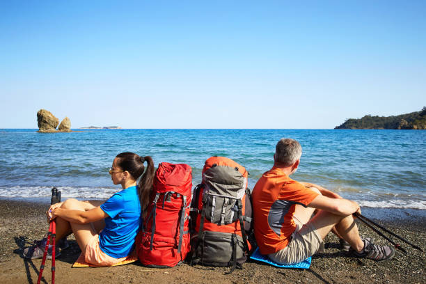 istock Adventure trek along the coast with a backpack in the summer. 1131178211