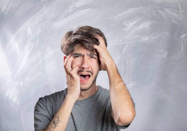 istock Young bearded man horrified portrait in studio 1131178212
