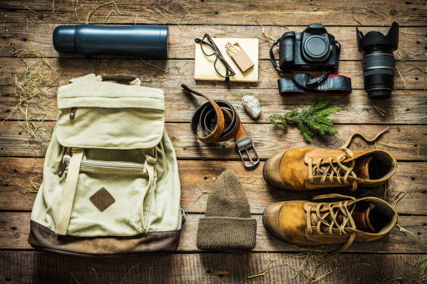 istock Traveling - packing (preparing) for adventure trip concept 1131178437