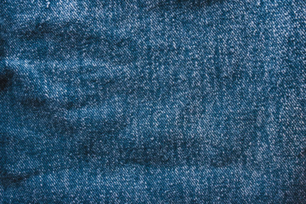 istock Background jeans, blue denim texture fabric with a seam of fashionable design. Empty pattern copy space 1131179862