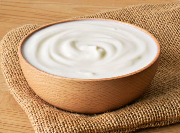 istock Delicious yogurt scene with wooden bowl 1131180823