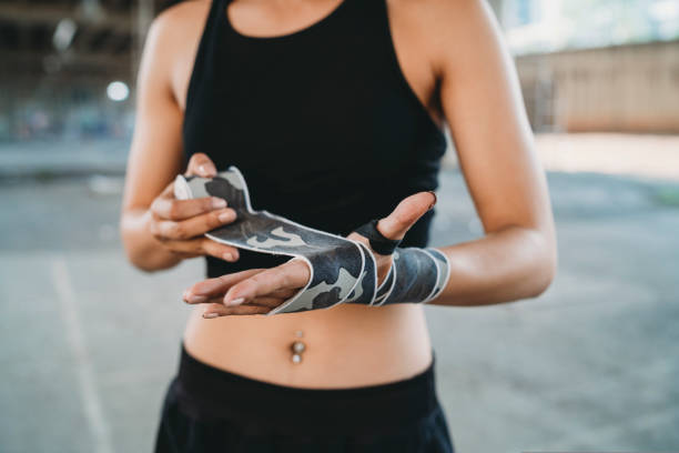 istock Muay Thai woman fighter wearing handwraps 1131181445
