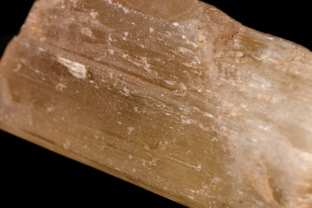 istock Macro mineral stone Spodumene on a black background 1131182149