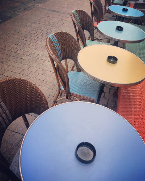 istock Empty Bordeaux sidewalk cafe tables and chairs, France 1131186049
