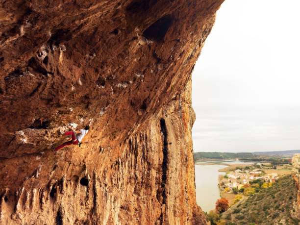 istock Young man sport climbing in overhanging position 1131186171