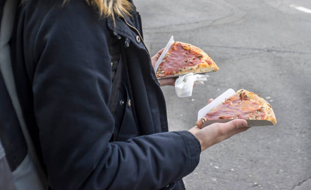istock The girl holds two pizzas in her hands 1131188130